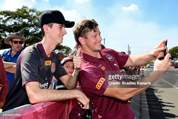 Harry Grant takes a selfie with a fan during the Queensland Maroons State of Origin fan day on June 01, 2021 in Bundaberg, Australia.