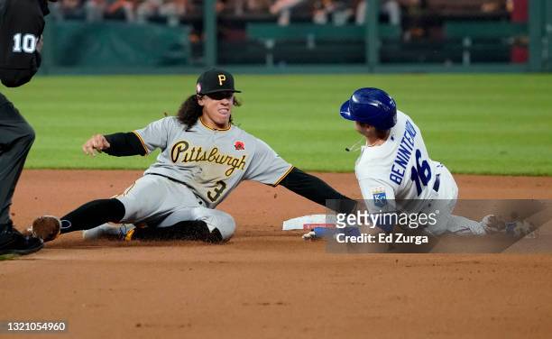 Andrew Benintendi of the Kansas City Royals is tagged out by Cole Tucker of the Pittsburgh Pirates as he tries to steal second in the eight inning at...