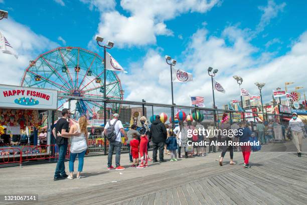 People wait in line for Luna Park at Coney Island on Memorial Day in the Brooklyn Borough of New York on May 31, 2021 in New York City. On May 19,...