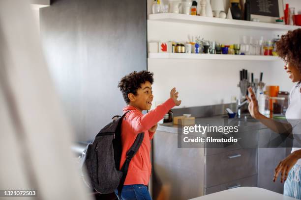 excited boy going to school - schoolboy stock pictures, royalty-free photos & images
