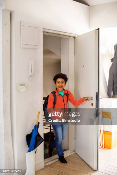 excited children returning home from school - entering stock pictures, royalty-free photos & images