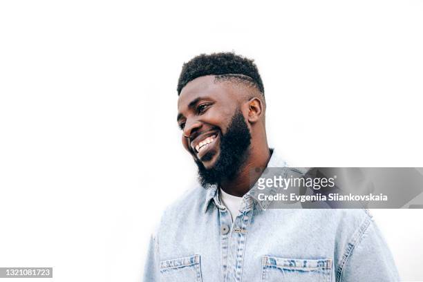 close-up portrait of smiling young african man isolated on white background. - afro hairstyle bildbanksfoton och bilder