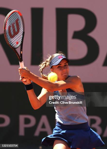 Irina Bara of Romania plays a backhand in their ladies first round match against Astra Sharma of Australia during day three of the 2021 French Open...