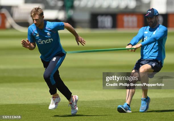 Joe Root trains with strength and conditioning coach Phil Scott during a training session before the first Test match against New Zealand at Lord's...