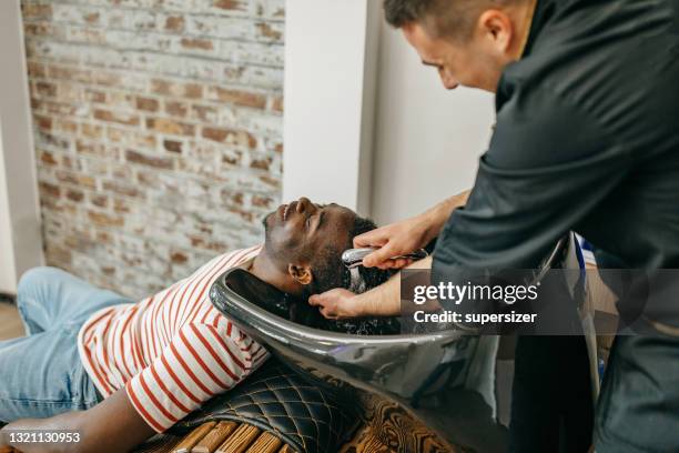 i like my hair clean - afro man washing stock pictures, royalty-free photos & images