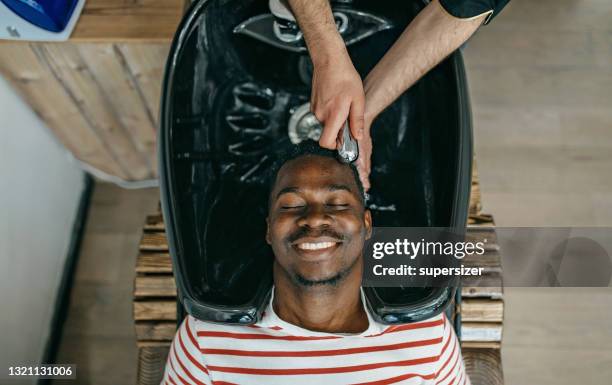 i like my hair clean - afro man washing stock pictures, royalty-free photos & images
