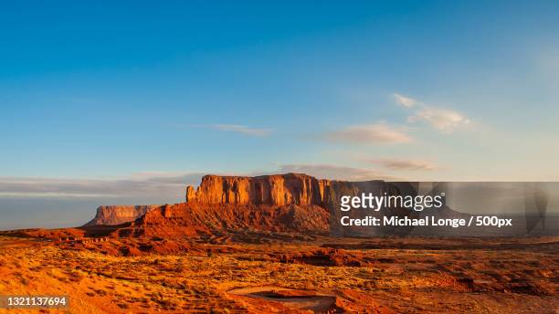 view of rock formations against cloudy sky - butte rocky outcrop stock pictures, royalty-free photos & images
