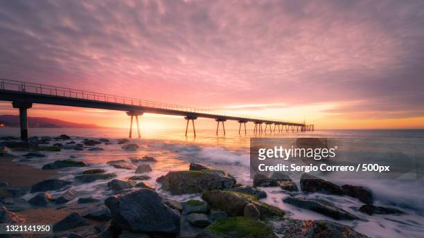 scenic view of sea against sky during sunset,pont del petroli,spain - badalona stock pictures, royalty-free photos & images