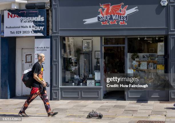 Member of the public walks through Cardiff whilst operating a remote control car on June 01, 2021 in Cardiff, Wales. 2 274 people in Wales have now...