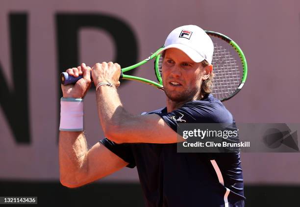 Andreas Seppi of italy plays a backhand in their mens first round match against Felix Auger Aliassime of Canada during day three of the 2021 French...