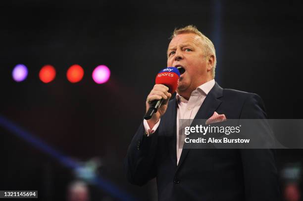 John McDonald, MC for the PDC introduces the players on stage during Night 17 of the Unibet Premier League Darts at Marshall Arena on May 28, 2021 in...