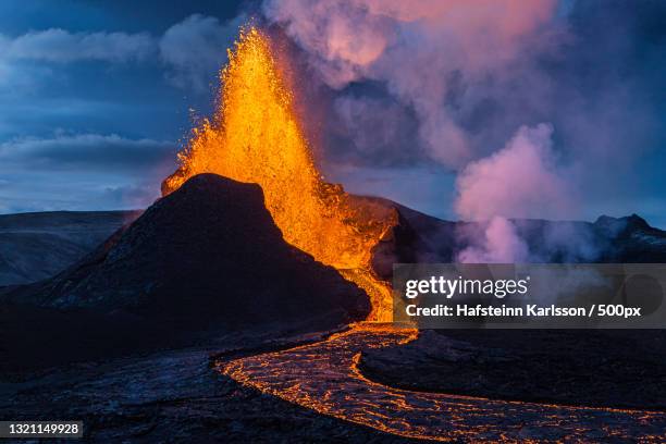 scenic view of lava against sky,grindavik,iceland - 噴出 ストックフォトと画像