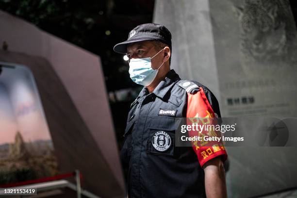 Security guard patrols as people visit the Wuhan Nature History Museum during International Children's Day on June 1, 2021 in Wuhan, Hubei province,...