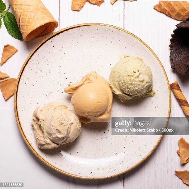 high angle view of ice cream in plate on table - ice cream scoop stock pictures, royalty-free photos & images