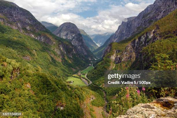 scenic view of mountains against sky,stalheim gorge,norway - voss photos et images de collection