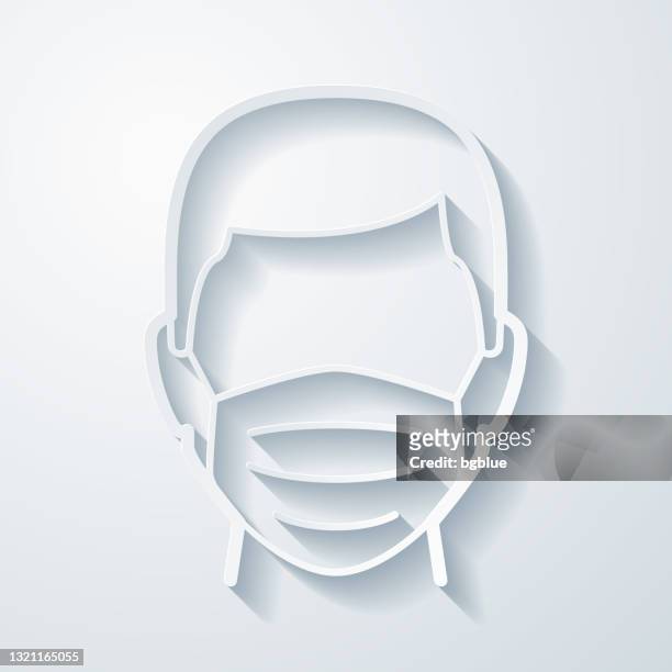 mann in medizinischer gesichtsschutzmaske. icon mit papierschnitteffekt auf leerem hintergrund - mundschutz stock-grafiken, -clipart, -cartoons und -symbole