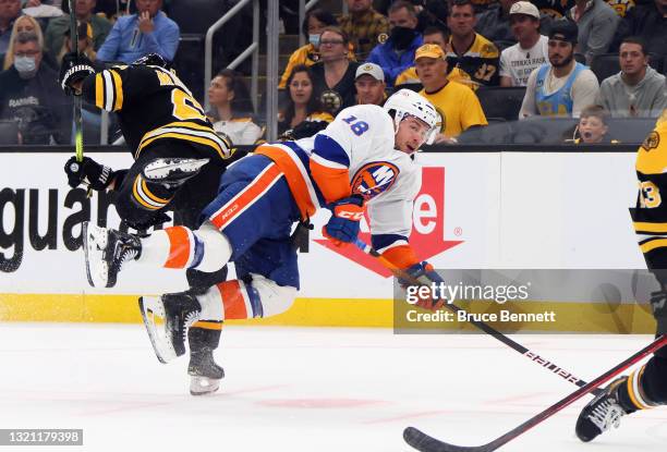 Anthony Beauvillier of the New York Islanders is checked by Brad Marchand of the Boston Bruins during the second period in Game Two of the Second...