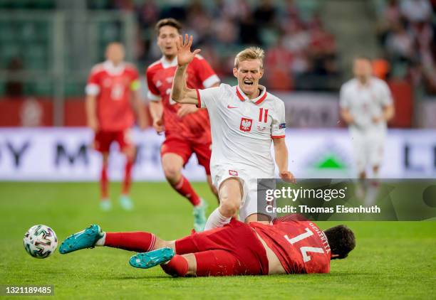 Karol Swiderski of Poland in action with Georgiy Dzhikiya of Russia during the international friendly match between Poland and Russia at the...