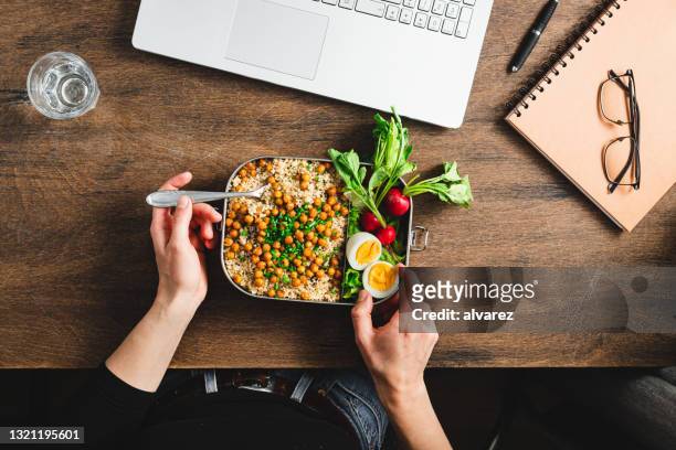 healthy lunch break at work - chick pea salad stock pictures, royalty-free photos & images