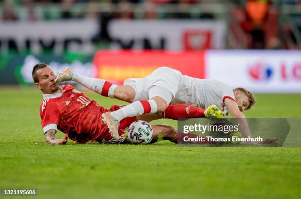 Kamil Jozwiak of Poland in action with Anton Zabolotnyi of Russia during the international friendly match between Poland and Russia at the Municipal...