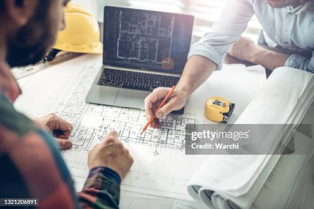 teamworking is the key for success - architecture plans stock pictures, royalty-free photos & images