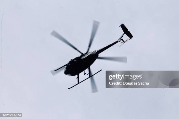 low angle view of a helicopter in flight - air ambulance stock-fotos und bilder