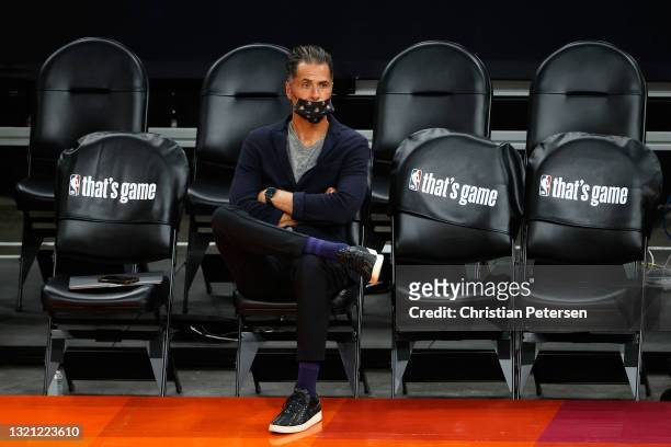 General manager Rob Pelinka of the Los Angeles Lakers sits courtside before Game Five of the Western Conference first-round playoff series at Phoenix...