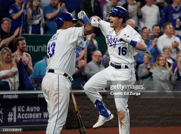 Andrew Benintendi of the Kansas City Royals celebrates his grand slam with Salvador Perez in the fifth inning against the Pittsburgh Pirates at...