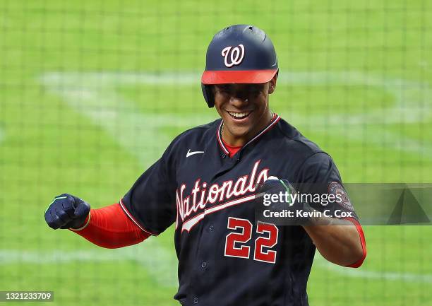 Juan Soto of the Washington Nationals reacts after hitting a two-run homer in the eighth inning against the Atlanta Braves at Truist Park on June 01,...
