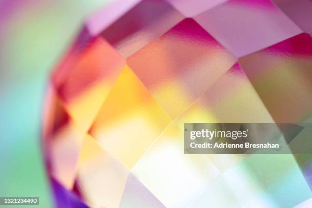 prism with pink and orange light effects - pink diamond stock pictures, royalty-free photos & images