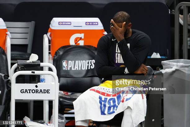 LeBron James of the Los Angeles Lakers reacts on the bench during the second half in Game Five of the Western Conference first-round playoff series...