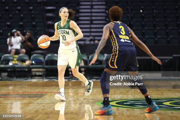 Sue Bird of the Seattle Storm dribbles down the court against Danielle Robinson of the Indiana Fever during the third quarter at Angel of the Winds...