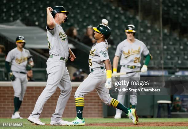 Stephen Piscotty and Tony Kemp of the Oakland Athletics celebrate after Kemp's two-run home run against the Seattle Mariners during the eighth inning...