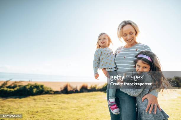 mother carrying the family - rural land stock pictures, royalty-free photos & images