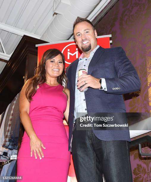 Television sportscaster Hazel Mae and husband Kevin Barker pose for a photo as they attend the launch of her new clothing line event held on the...