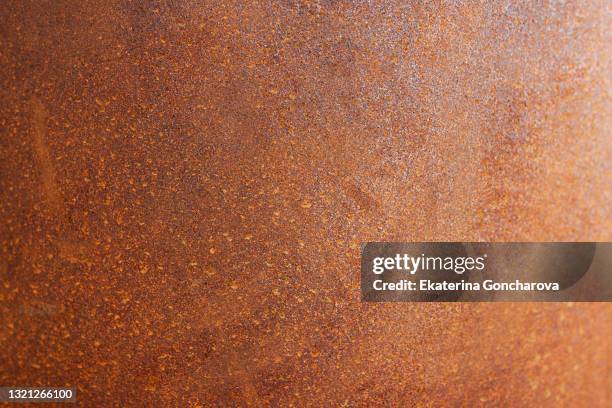 the background is made of a rusty metal surface. trendy background in the style of grunge - rust colored stock pictures, royalty-free photos & images