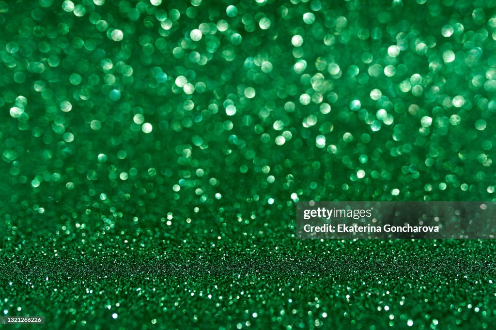 Beautiful Green Holiday Background With Glitter And Blurred And Focal  Lights For New Year Christmas Or Birthday High-Res Stock Photo - Getty  Images