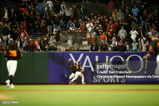 San Francisco Giants center fielder Kevin Pillar makes the catch on St. Louis Cardinals catcher Matt Wieters hit to center field and almost collides...