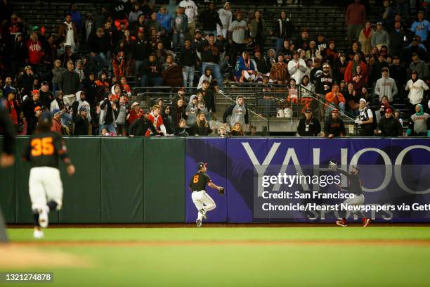 San Francisco Giants center fielder Kevin Pillar makes the catch on St. Louis Cardinals catcher Matt Wieters hit to center field and almost collides...