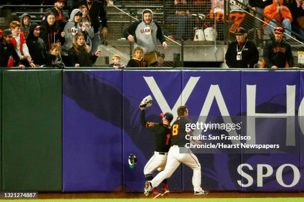 San Francisco Giants center fielder Kevin Pillar makes the catch on St. Louis Cardinals catcher Matt Wieters hit to center field and almost collides...