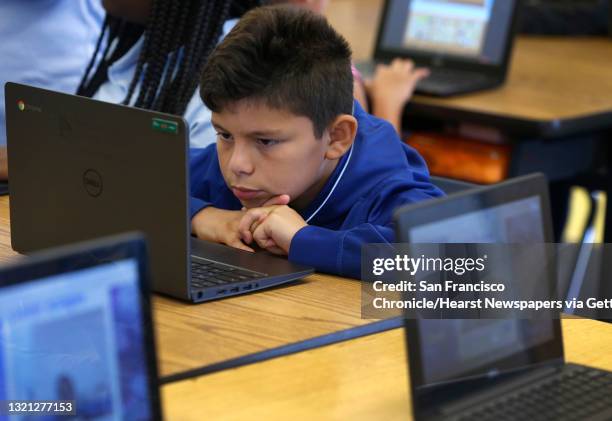 Joseph Riveracosta learns math on a Chromebook in Lynne Martin's 5th grade class at Markham Elementary School in Oakland, Calif. On Thursday, Sept....
