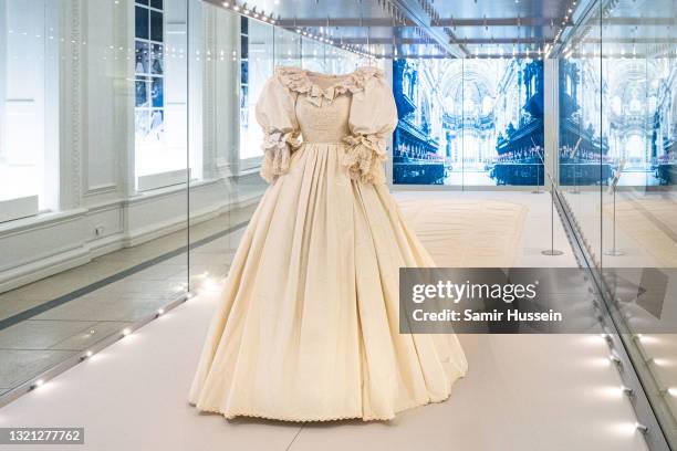 The wedding dress of Diana, Princess of Wales is displayed during the "Royal Style In The Making" exhibition photocall at Kensington Palace on June...