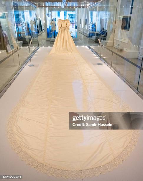 The wedding dress of Diana, Princess of Wales is displayed during the "Royal Style In The Making" exhibition photocall at Kensington Palace on June...