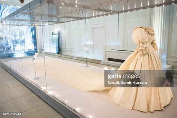 The wedding dress of Diana, Princess of Wales is displayed during the "Royal Style In The Making" exhibition photocall at Kensington Palace on June...