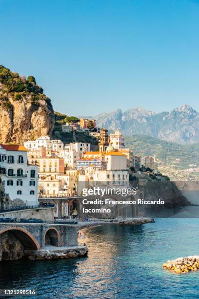 atrani, amalfi coast, campania, sorrento, italy. view of the town and the seaside in a summer sunset - naples italy church stock pictures, royalty-free photos & images