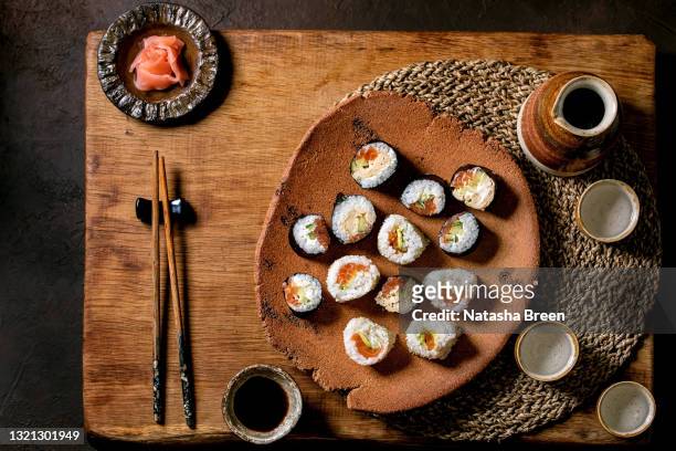 homemade sushi rolls set with salmon, japanese omelette, avacado and soy sauce - nori stock pictures, royalty-free photos & images