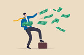Success and wealthy fortune entrepreneur, investment profit and earning, FED stimulus monetary policy concept, happy businessman millionaire throw out pile of money banknotes flying into the air.