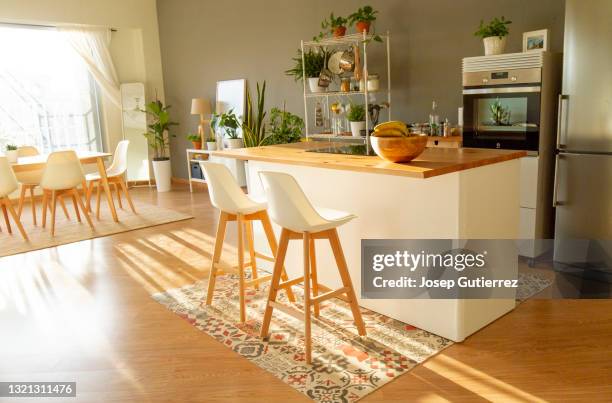 open-plan kitchen nordic style in a loft with big window on the foreground - kitchen sunlight stock pictures, royalty-free photos & images