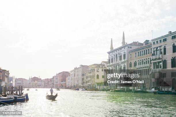 Venetian gondola on canal in Venice, Italy