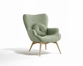 3d rendering of an isolated modern pale green mid century cosy lounge wingback armchair